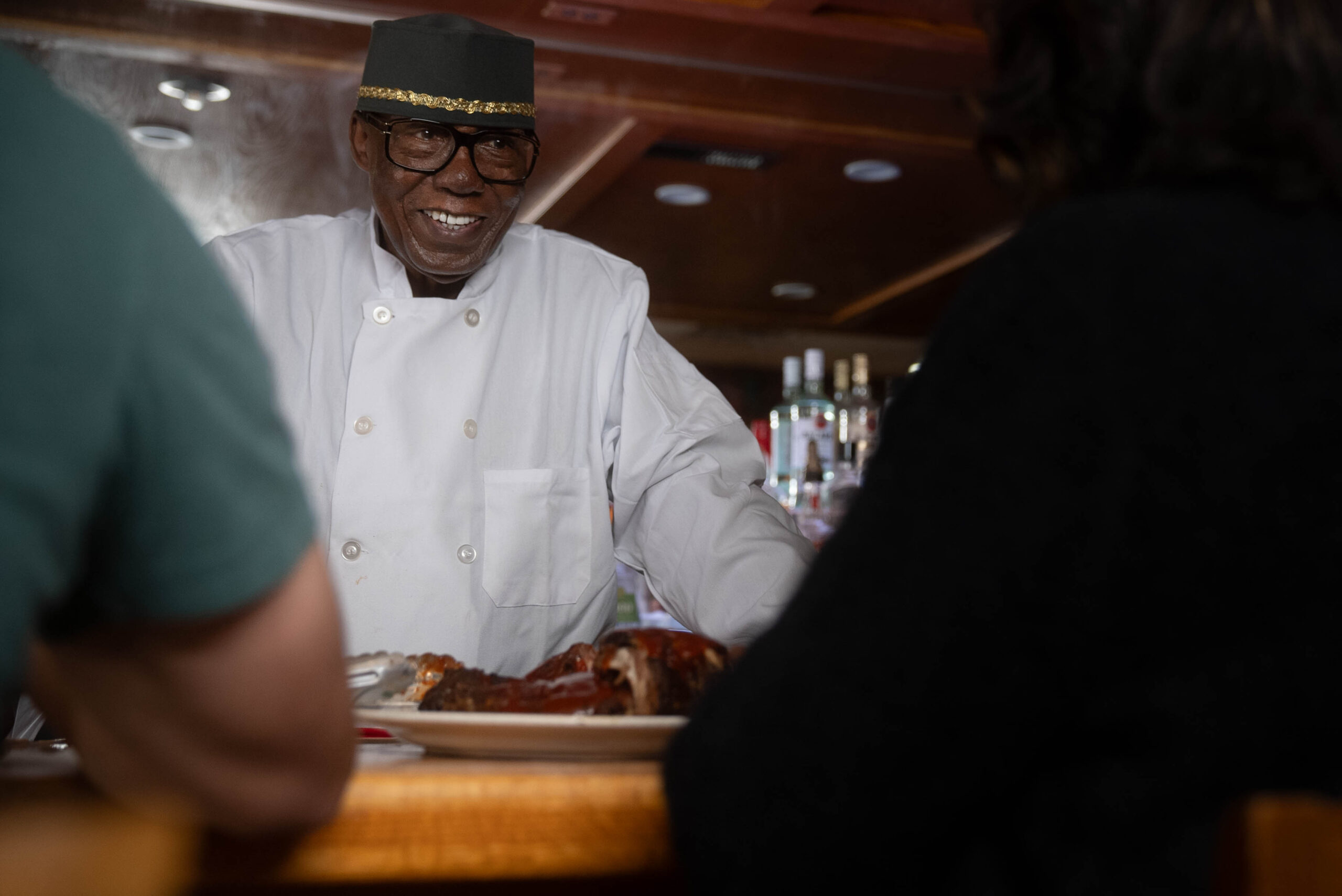 Charlie Robinson is smiling at his customers.