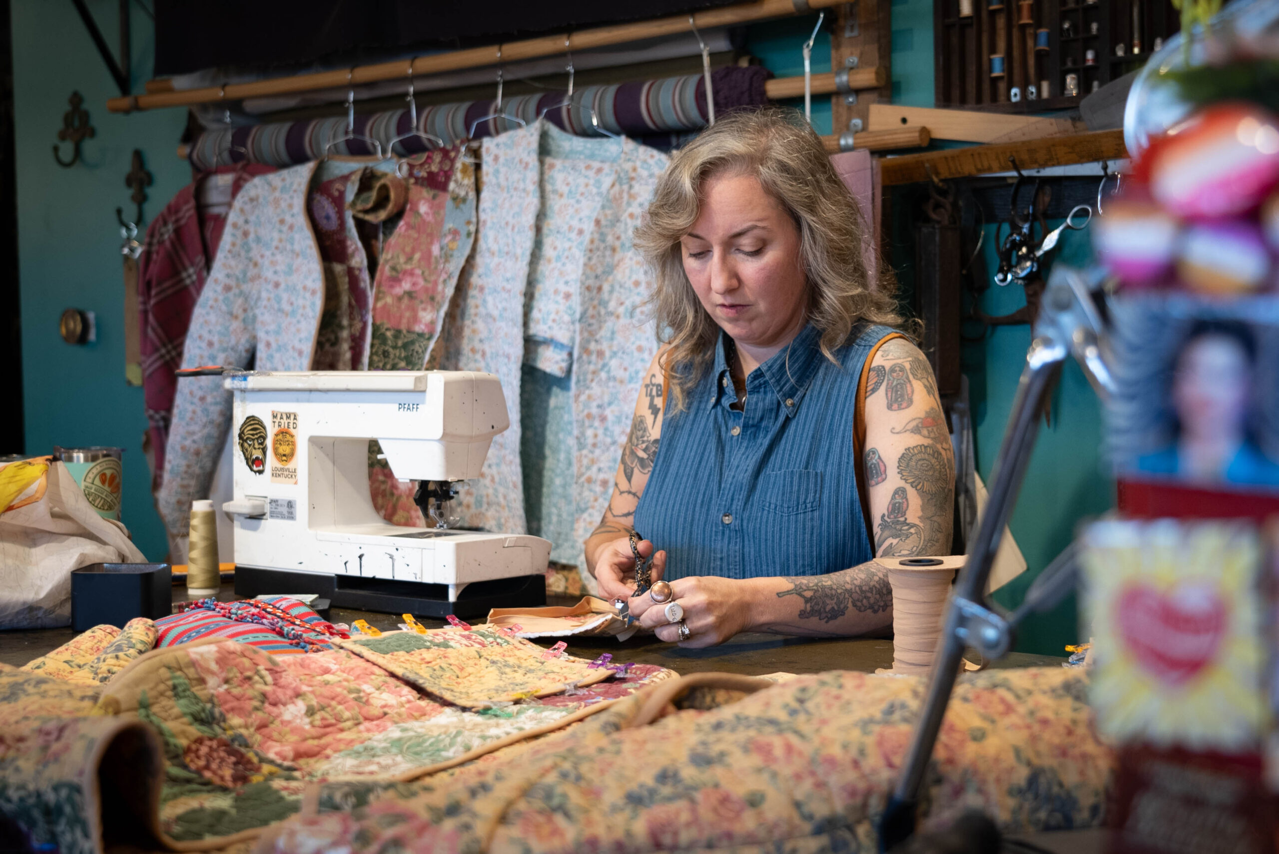 Co-owner Shirley Kienitz making clothes