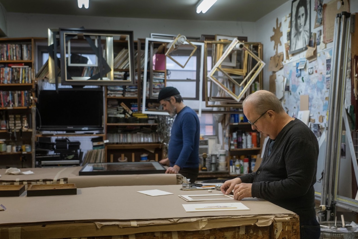 Staff customizing frames.